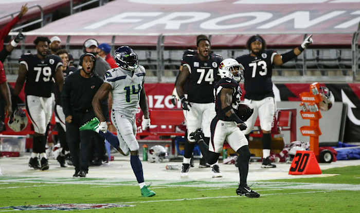 Arizona Cardinals strong safety Budda Baker (32) intercepts a pass and is tackled short of the goal line by Seattle Seahawks wide receiver DK Metcalf (14) in the first half during a game at State Farm Stadium. Mandatory Credit: Rob Schumacher/The Arizona Republic via USA TODAY NETWORK Nfl Seattle Seahawks At Arizona Cardinals